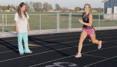 Watching her daughter practice