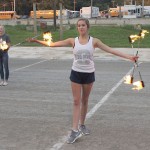 Twirling fire batons